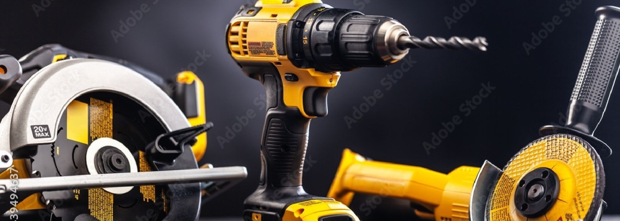 Yellow and black cordless power tools including drill, circular saw, and angle grinder – professional power tools for construction and woodworking